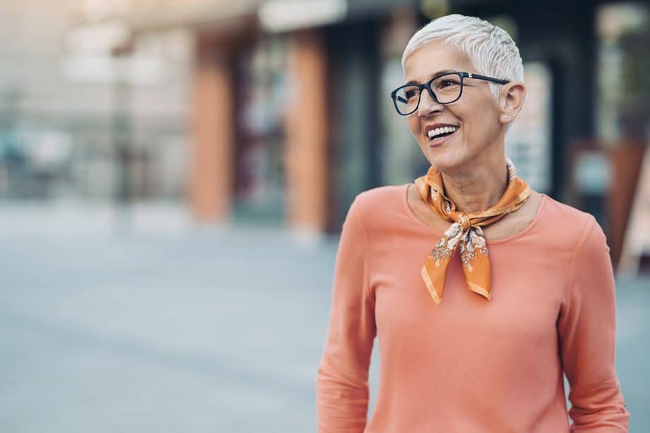 mature woman smiling with glasses